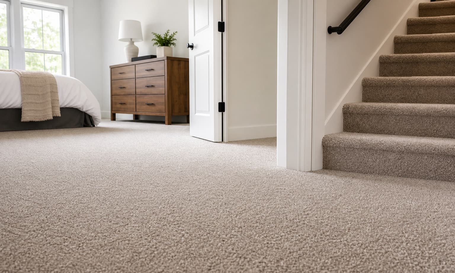 Fresh neutral carpet in a bedroom and stair area
