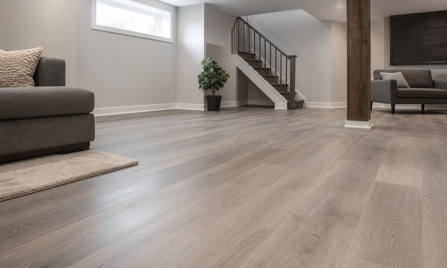 Modern luxury vinyl plank flooring in a finished basement